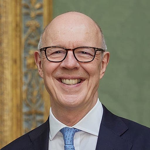 John Booth CVO, Trustee of the Queen Elizabeth Trust, smiling at the camera in a formal portrait taken at National Gallery.