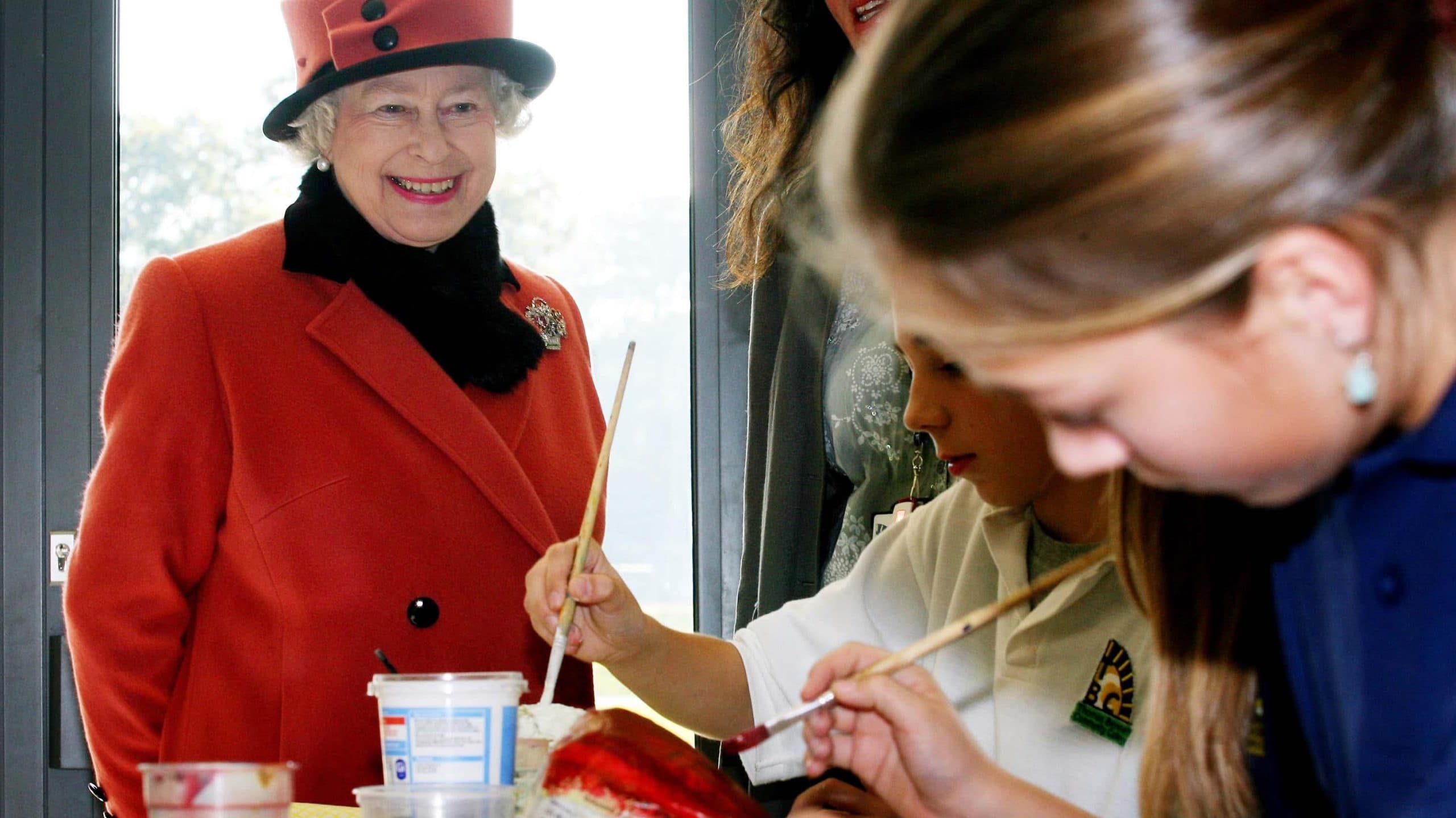 Britain's Queen Elizabeth II views an art class at the Thomas Bennett Community College in Crawley, West Sussex.