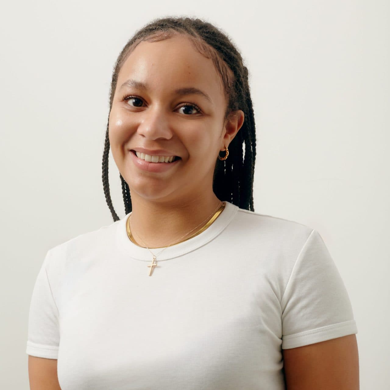 Paris Habib, Squad Community Manager at My Life My Say, smiling at the camera in a studio portrait.